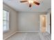 Spacious bedroom with neutral walls, carpet, a ceiling fan, and a bright window at 2035 Lena Carter Rd, Buford, GA 30519