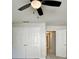 Bedroom with double closets, standard window, ceiling fan and neutral color scheme at 2035 Lena Carter Rd, Buford, GA 30519