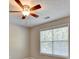Bedroom with standard window, ceiling fan and neutral color scheme at 2035 Lena Carter Rd, Buford, GA 30519