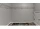 Empty walk-in closet features neutral paint, wire shelving, and slate tile flooring at 2035 Lena Carter Rd, Buford, GA 30519