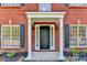 Close up of front door with white columns and black shutters at 2035 Lena Carter Rd, Buford, GA 30519