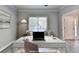 Bright, virtual home office with a desk and neutral furniture at 2035 Lena Carter Rd, Buford, GA 30519