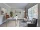 Bright, virtually staged home office featuring neutral furniture and modern accents at 2035 Lena Carter Rd, Buford, GA 30519