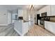 Modern kitchen featuring stainless steel appliances, a breakfast bar, and an open layout at 2035 Lena Carter Rd, Buford, GA 30519