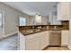Kitchen featuring stainless steel appliances, granite countertops, and a breakfast bar overlooking the living area at 2035 Lena Carter Rd, Buford, GA 30519