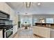 Bright kitchen with white cabinets, stainless steel appliances, granite countertops, and a breakfast nook with bay windows at 2035 Lena Carter Rd, Buford, GA 30519