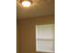 Cozy bedroom with a flush mount light and bright, sunlit window at 5512 Arrowhead Dr, Acworth, GA 30102