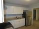 Well lit kitchen features granite counters, stainless steel appliances, and white cabinetry at 5512 Arrowhead Dr, Acworth, GA 30102