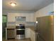 Bright kitchen features granite counters, stainless steel appliances, and white cabinets at 5512 Arrowhead Dr, Acworth, GA 30102