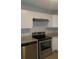 Kitchen featuring granite countertops, stainless appliances, and bright white cabinets at 5512 Arrowhead Dr, Acworth, GA 30102