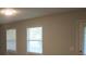Bright living room features wood-look floors and sun-filled windows at 5512 Arrowhead Dr, Acworth, GA 30102