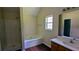 Bathroom with soaking tub, separate shower, and vanity with sink at 6572 Chestnut Oaks Rdg, Lithonia, GA 30038