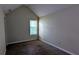 A cozy bedroom with neutral walls, carpet flooring, and a window for natural light at 6572 Chestnut Oaks Rdg, Lithonia, GA 30038
