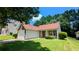 Charming single-story home featuring a well-maintained lawn and attached one car garage at 6572 Chestnut Oaks Rdg, Lithonia, GA 30038