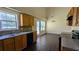 Well-equipped kitchen featuring wooden cabinets, black appliances, and eat in area at 6572 Chestnut Oaks Rdg, Lithonia, GA 30038