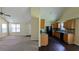 Spacious living room and kitchen area featuring neutral colors and vaulted ceilings at 6572 Chestnut Oaks Rdg, Lithonia, GA 30038