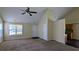 Inviting living room with vaulted ceilings, neutral walls, and plush carpeting at 6572 Chestnut Oaks Rdg, Lithonia, GA 30038