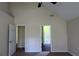 Carpeted main bedroom with vaulted ceiling and ensuite bathroom at 6572 Chestnut Oaks Rdg, Lithonia, GA 30038
