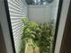 Bright interior atrium filled with green plants and sunlight at 975 Willeo Rd, Roswell, GA 30075