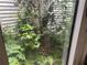 Interior atrium with lush green plants and natural light at 975 Willeo Rd, Roswell, GA 30075