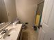 Simple bathroom featuring a vanity with built-in sink and shower-tub at 975 Willeo Rd, Roswell, GA 30075
