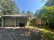 Detached two-car garage features dual doors and a concrete driveway on a sunny day at 975 Willeo Rd, Roswell, GA 30075