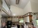 Bright kitchen with white cabinets, overhead loft, and floral accents at 975 Willeo Rd, Roswell, GA 30075