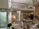 Open kitchen featuring an island cooktop and view of the loft at 975 Willeo Rd, Roswell, GA 30075