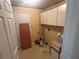 Functional laundry room featuring storage cabinets at 975 Willeo Rd, Roswell, GA 30075