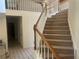 Carpeted staircase with white spindles and wood railing leads to the second level at 975 Willeo Rd, Roswell, GA 30075