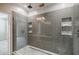 Modern walk-in shower with grey tiling, shower niche and glass door perfect for relaxing after a long day at 1505 Walker Ave, College Park, GA 30337