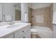 Bathroom features a single sink vanity, tile backsplash and tiling around tub, which provides a clean relaxing space at 1505 Walker Ave, College Park, GA 30337