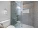Elegant bathroom with gray tiled walk-in shower and glass door at 1505 Walker Ave, College Park, GA 30337