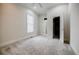 Spacious bedroom with plush carpet, ample natural light, and a large walk-in closet at 1505 Walker Ave, College Park, GA 30337
