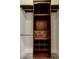 Custom closet features dark wood shelves, drawers, and storage options, providing ample space for organization at 1505 Walker Ave, College Park, GA 30337