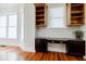 This image showcases a small desk area with built-in shelves, drawers, and a countertop at 1505 Walker Ave, College Park, GA 30337