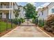 Gated driveway with mature trees, ensuring privacy and security at 1505 Walker Ave, College Park, GA 30337