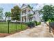Beautiful two-story home with a gated driveway and well-maintained landscaping at 1505 Walker Ave, College Park, GA 30337