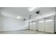 Clean, empty two car garage with white walls, overhead lights, and automatic doors at 1505 Walker Ave, College Park, GA 30337