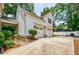 Exterior view showcasing the two-car garage and driveway of the charming home at 1505 Walker Ave, College Park, GA 30337