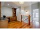 Cozy hallway with wooden floors, built-in shelves, and a desk area, ideal for a home office or study space at 1505 Walker Ave, College Park, GA 30337