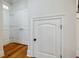 Hallway with hardwood floors and doors for storage at 1505 Walker Ave, College Park, GA 30337