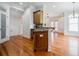 View of the kitchen island area, connecting to the living area at 1505 Walker Ave, College Park, GA 30337