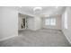Spacious living room featuring plush carpeting, recessed lighting and neutral walls at 1505 Walker Ave, College Park, GA 30337