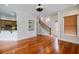 Bright living space boasts hardwood floors, built-in shelving, and staircase at 1505 Walker Ave, College Park, GA 30337
