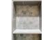 Close-up of a tiled shower niche featuring a hexagonal marble tile backsplash and a convenient shelf at 1505 Walker Ave, College Park, GA 30337
