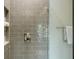Modern shower showing gray tiling, sleek fixtures, and an integrated niche for storage, adding convenience and style at 1505 Walker Ave, College Park, GA 30337