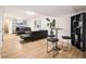 Spacious finished basement with bar seating, black leather sofas, and stairs at 3388 Hyland Dr, Decatur, GA 30032