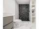Stylish bathroom features modern vanity and open shower with black and white mosaic tiles at 3388 Hyland Dr, Decatur, GA 30032