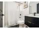 Well-lit bathroom with tiled shower, black fixtures, and a modern vanity at 3388 Hyland Dr, Decatur, GA 30032